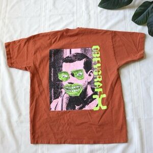 Obey Grafx orange heavy t-shirt with man graphic on back